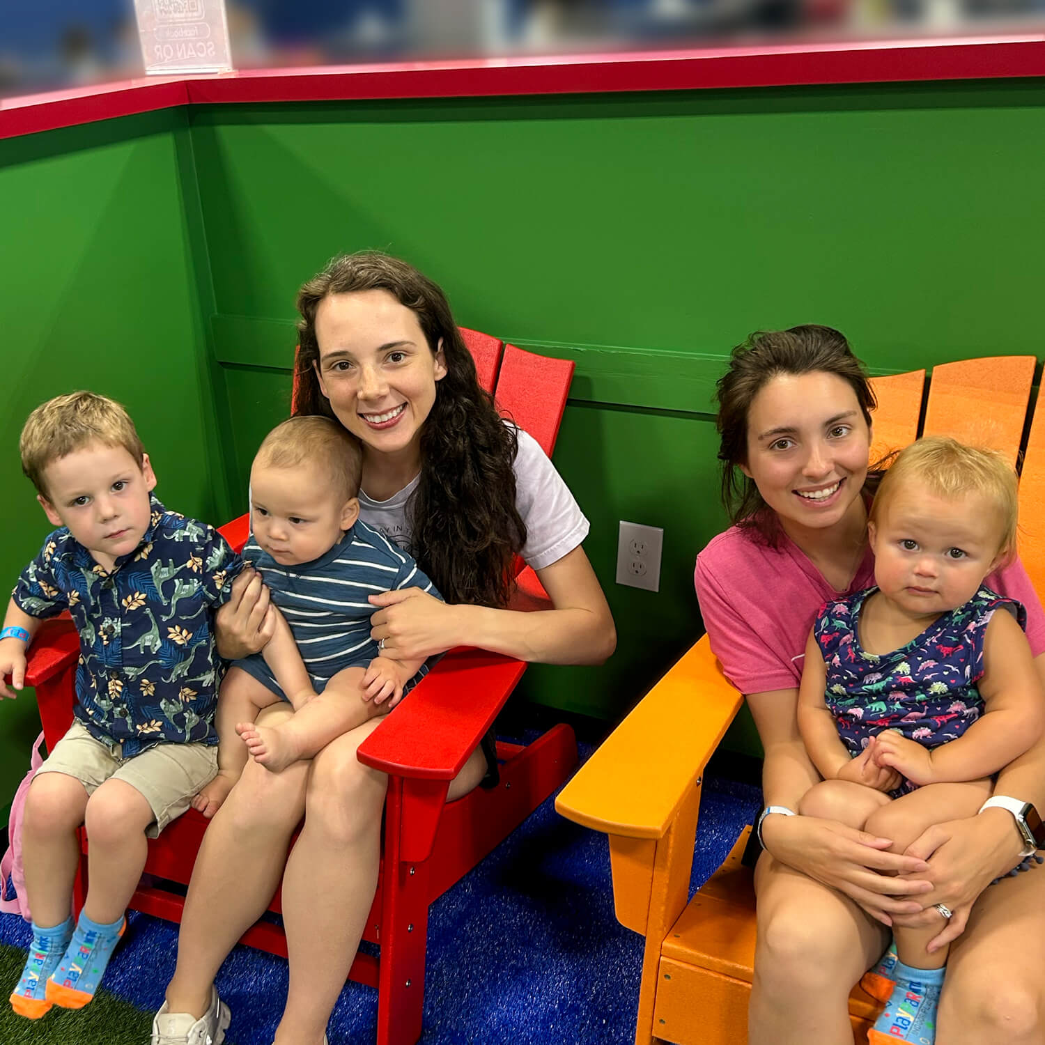 Mom's relaxing inside of playpark mtx indoor playground in mansfield Texas